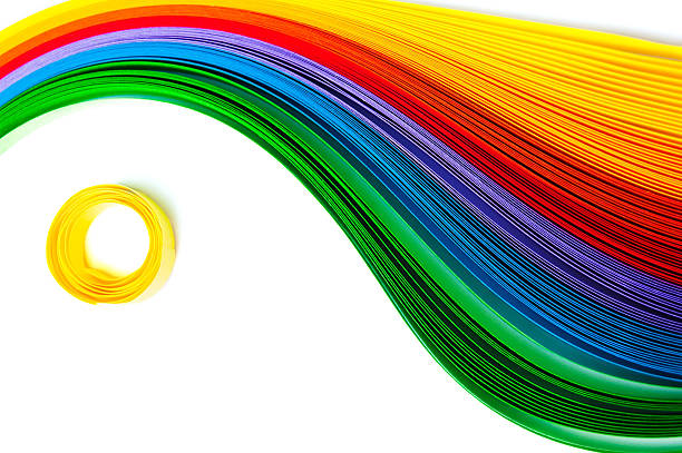 istock Rainbow colored quilling paper laid out in waves and shapes 477567852