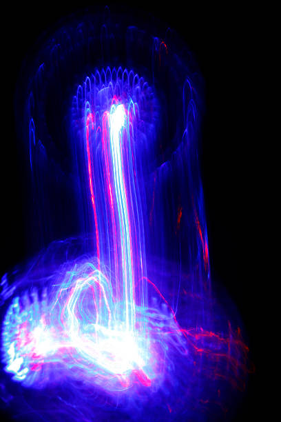 istock Luminous paths of a moving blue purple light ball 477569275