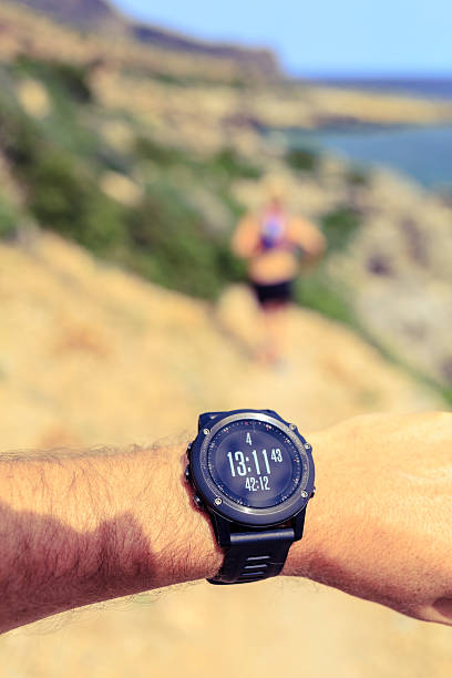 istock Running and looking at sport watch 477569616