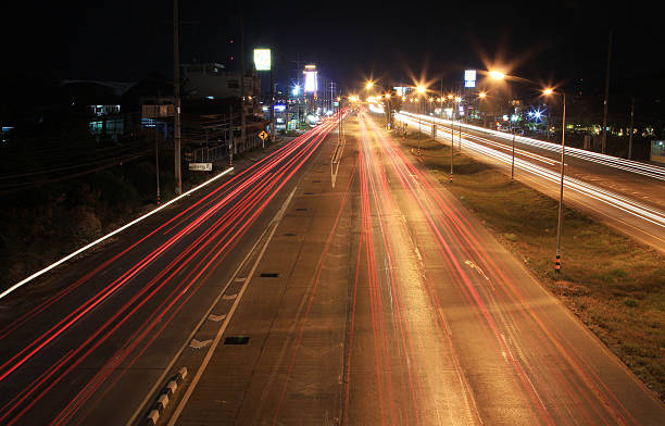 istock Busy Traffic at night on highway. 477569882