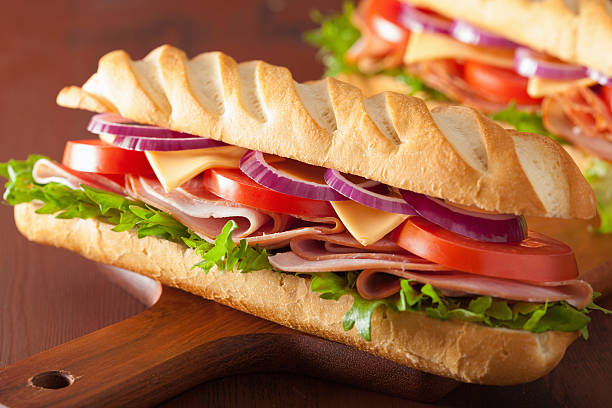 istock long baguette sandwich with ham cheese tomato lettuce 477572472