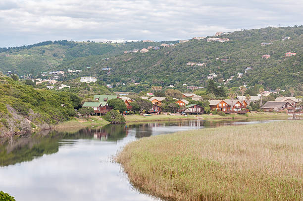 Wilderness town and lake area Wilderness, South Africa - January 5, 2015: View across the  Wilderness town and lake area with the Touw River in front. A large part of this area forms part of the Wilderness National Park which includes several fresh water lakes george south africa stock pictures, royalty-free photos & images
