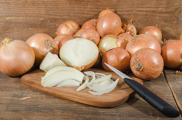 istock Fresh sliced and whole onions 477573516
