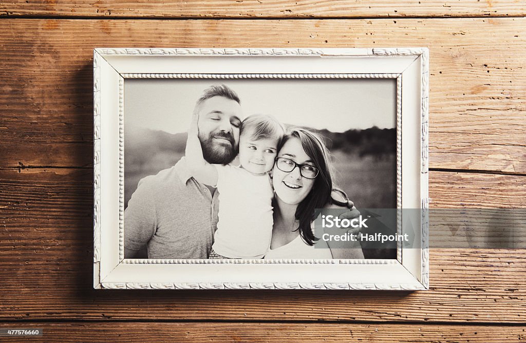 Fathers day composition Fathers day composition - picture frame with a black and white photo. Studio shot on wooden background. Picture Frame Stock Photo