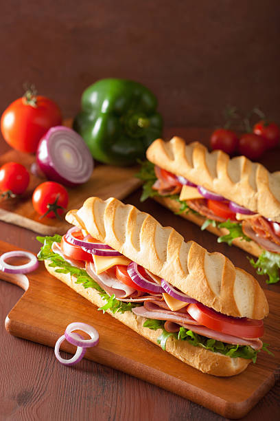 istock long baguette sandwich with ham cheese tomato lettuce 477577096