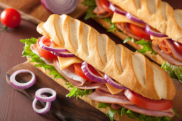 istock long baguette sandwich with ham cheese tomato lettuce 477577100