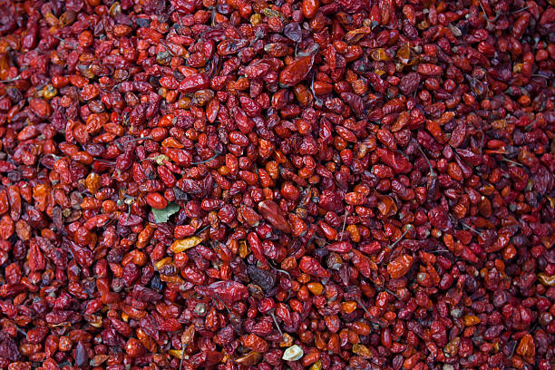 Pile of dried chiltepe peppers at Chichicastenango market Guatemala Pile of dried chiltepe peppers for sale at Chichicastenango market Guatemala spicery stock pictures, royalty-free photos & images