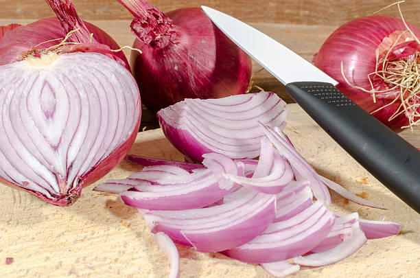 istock Fresh sliced and whole red onions 477578908