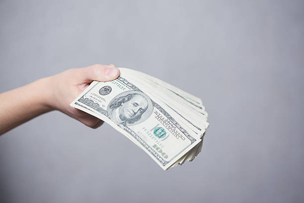 istock Money in female hands 477580462