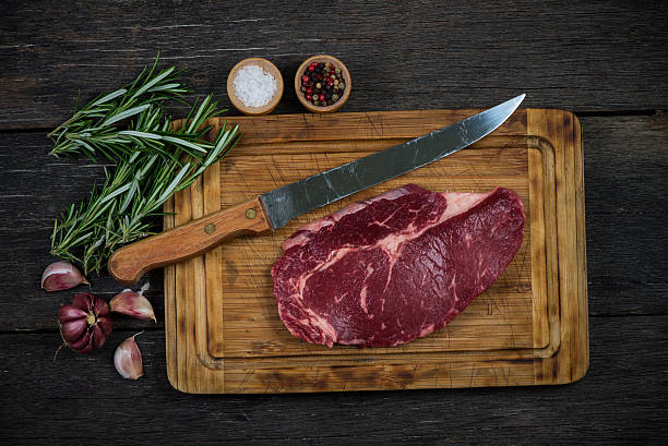 istock Raw ribeye beef steak with herbs and spices from above 477581380