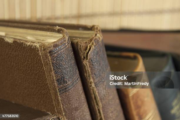 Front View Of Old Books Stacked On A Shelf Stock Photo - Download Image Now - 2015, Aging Process, Ancient