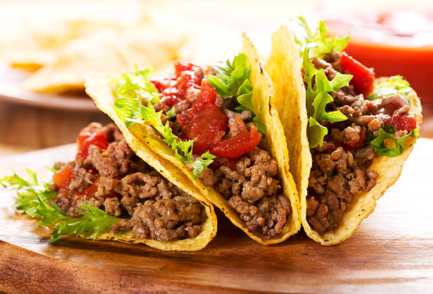 plate of tacos plate of tacos on wooden table taco photos stock pictures, royalty-free photos & images