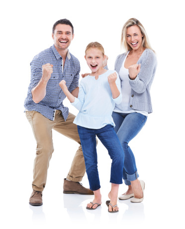 Studio shot of a happy family with their hands in fists smiling at the camera against a white background