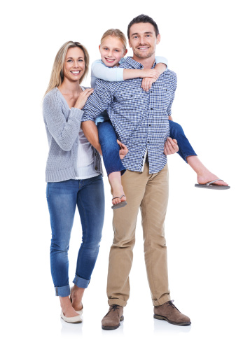 Studio shot of a mother, daughter and father smiling at the camera against a white background