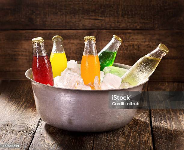 Various Bottles Of Soda In The Bucket With Ice Stock Photo - Download Image Now - 2015, Bottle, Bucket