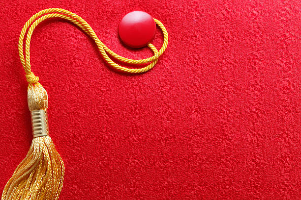 istock Red Graduation Cap With Gold Tassel 477585936