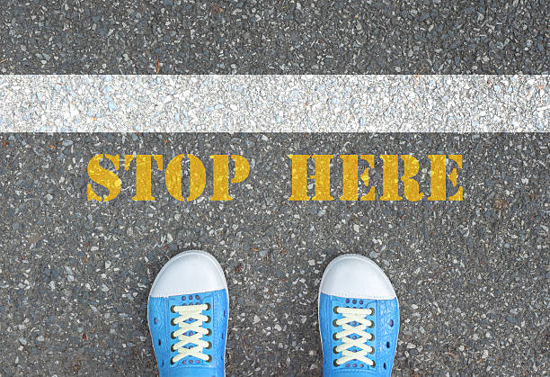 istock Shoes stop at stop line 477586356