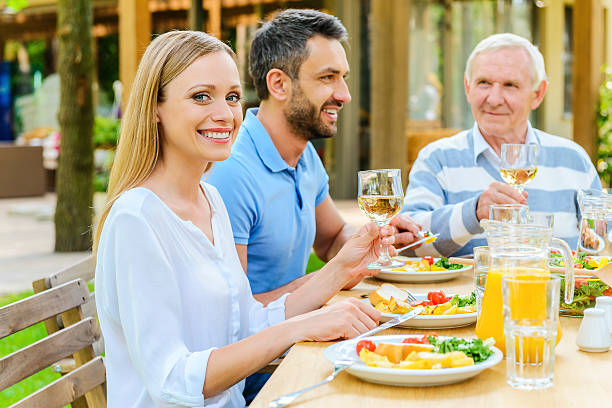 istock Enjoying dinner with family. 477586574