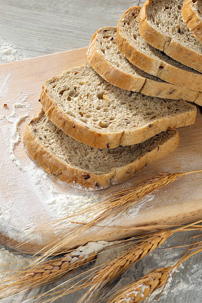 istock Rustic bread and wheat on an old vintage grey wood 477586838