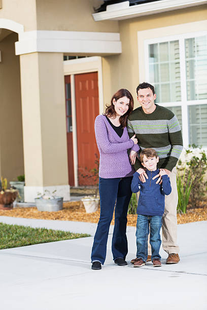 istock Young family outside home 477589071