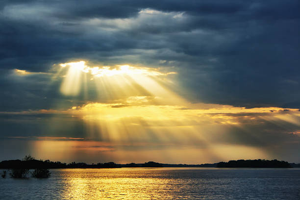 istock Heaven rays of sunshine on river 477590958