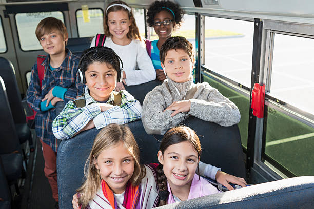 istock Children riding school bus 477590993