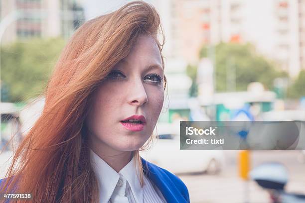 Beautiful Redhead Girl Posing In An Urban Context Stock Photo - Download Image Now - 2015, Adult, Adults Only