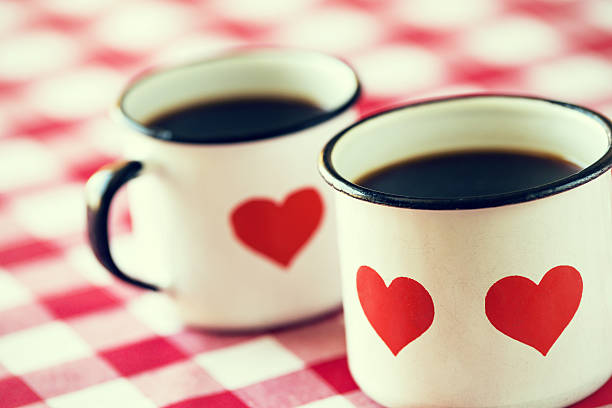 istock Two cups of coffee in old enamel mugs 477592100
