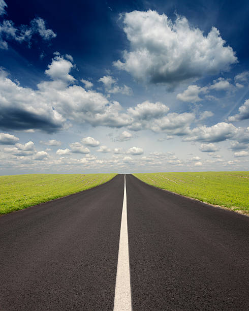 istock Driving uphill on an empty road at idyllic sunny day 477594302