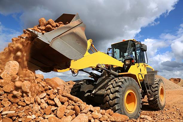 Front End Loader Tipping Stone stock photo