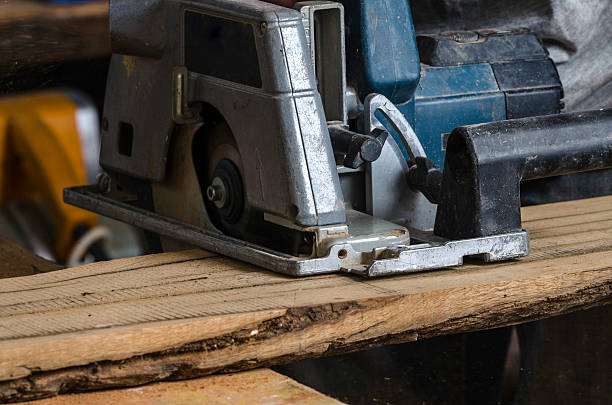 istock Male carpenter is cutting wood. 477594568