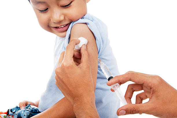 Vaccination Little child have a vaccination shot in studio polio vaccine stock pictures, royalty-free photos & images