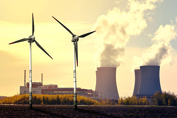 istock Nuclear power plant and wind turbines 477595040