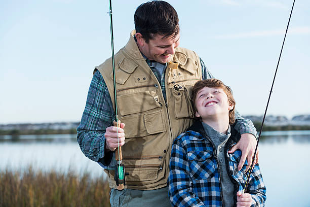 istock Father and son fishing 477596139
