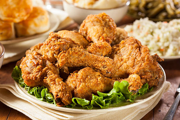 Homemade Southern Fried Chicken Homemade Southern Fried Chicken with Biscuits and Mashed Potatoes crunchy stock pictures, royalty-free photos & images