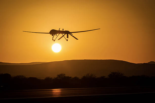 istock unmanned drone low pass in sunset panorama landscape 477598506