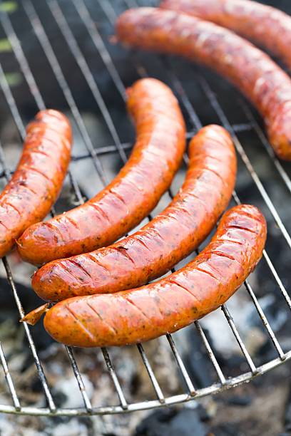 istock Tasty polish sausage on grill 477598940