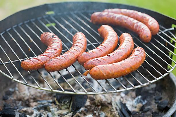 istock Tasty polish sausage on grill 477598946