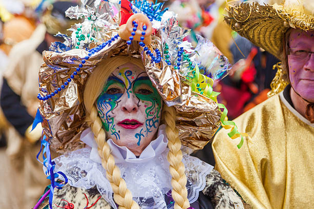 Collecting mask. Carnival decoration isolated on white wallpaper. Small Witch larva head. Disguise for the fifth season. Hanger for the wall. Saulgau.