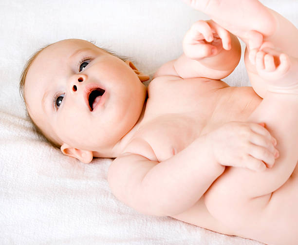 istock happy charming baby is lying on the back 477601604