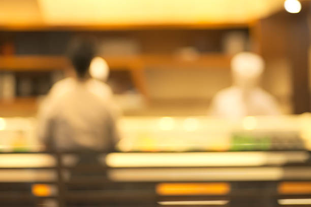 Blurry restaurant Abstract blurry sushi counter in vintage style decoration restaurant washoku stock pictures, royalty-free photos & images