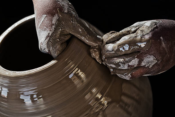 istock Muddy Hands of Pottery Craftsman Making Terracotta 477602320
