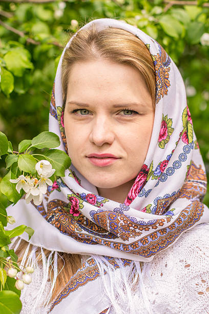 istock Beautiful woman in a headscarf smiling 477602504