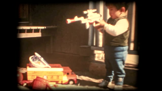 60's 8mm footage - Boy playing with a toy gun