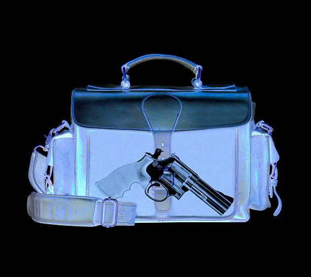 Xray scan detects weapon in criminals briefcase Xray scan detects weapon in criminals briefcase hand grenade photos stock pictures, royalty-free photos & images