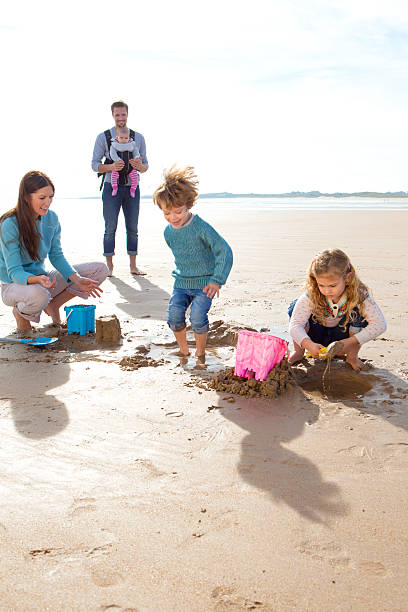 istock Family on the Beach 477608394