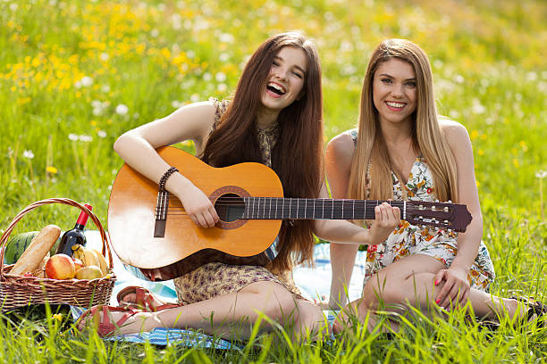 istock Two beautiful young women on a picnic 477608574