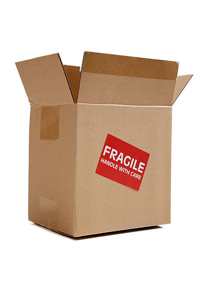 istock Brown cardboard moving box on white with a fragile sticker 477609073