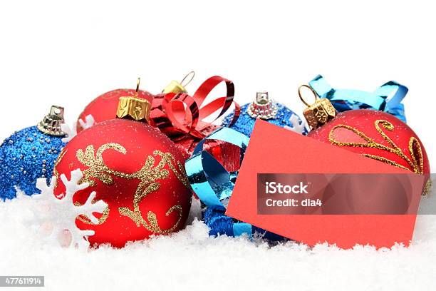 Group Redblue Christmas Decoration With Wishes Card On Snow Stock Photo - Download Image Now