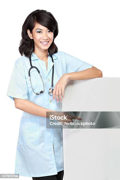 Female Doctor With A Blankboard Stock Photo - Download Image Now - 2015, Adult, Adults Only